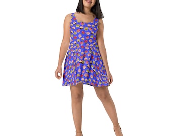 May include: A blue skater dress with a pattern of colorful cupcakes. The dress has a scoop neck and sleeveless design.