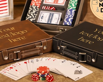 May include: Two personalised leather carrying cases for playing cards and poker chips. The cases are brown and black with gold lettering that says "Your text/logo here". The cases are open and show a deck of cards and poker chips.