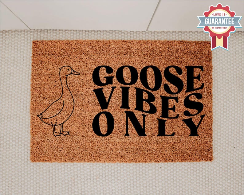 May include: A rectangular doormat with a brown coir surface. The mat features a black outline drawing of a goose on the left and the words "GOOSE VIBES ONLY" in large black letters.