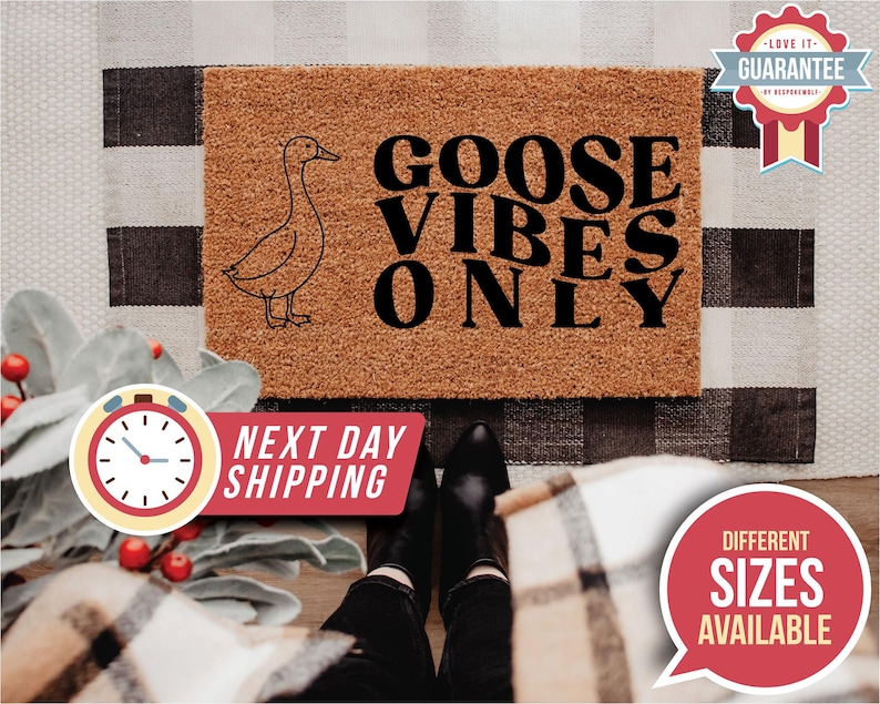 May include: A rectangular doormat with the text "GOOSE VIBES ONLY" and a goose illustration. The mat is brown with black text and a black goose outline. The background includes a black and white checkered pattern.