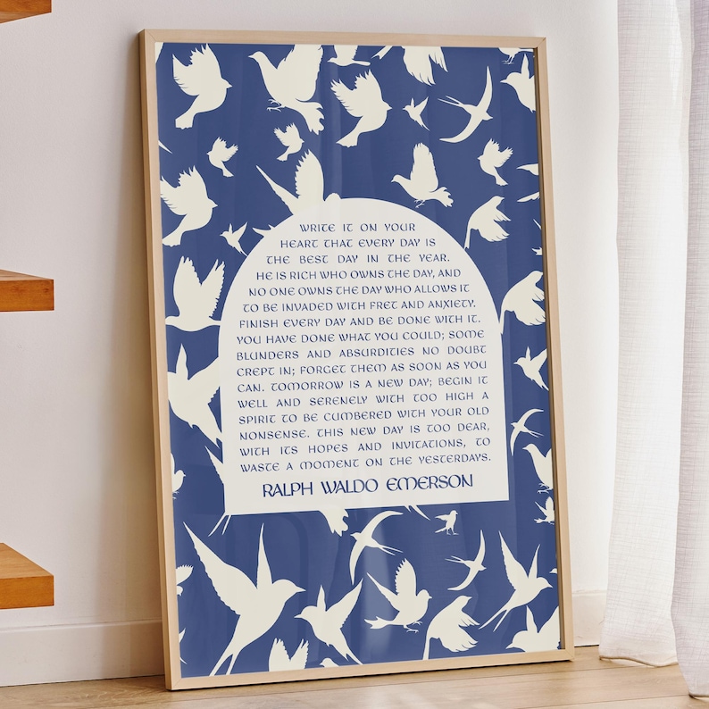 May include: A framed art print with a blue backdrop and white dove silhouettes. The print features a quote by Ralph Waldo Emerson in a white oval, within a wooden frame. The artwork is displayed indoors.