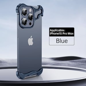 May include: A blue phone case with a raised camera lens protector and a cutout for the Apple logo. The case is designed for the iPhone 15 Pro Max.