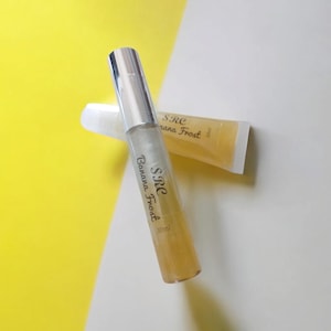 Banana Fruity Lip Gloss, non sticky, bottle, tube, moisturing, all clear gloss, cruelty free,non-gmo, mineral oil free, smooth, rejuvenates