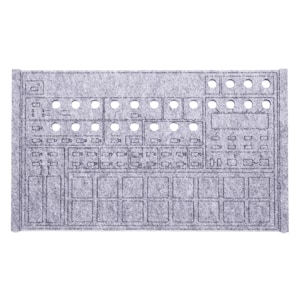 May include: A gray felt organizer with cutouts and a grid pattern, likely for electronic music equipment. The design includes various circular and rectangular openings, suggesting slots for knobs and buttons. A small potted succulent sits in the upper left corner.