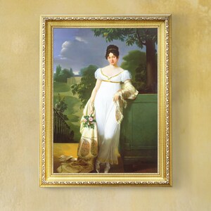 May include: A framed oil painting of a woman in a white dress standing in a garden setting. She is holding a bouquet of flowers and wearing a shawl. The painting is set against a backdrop of lush greenery and a cloudy sky.