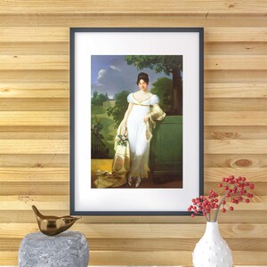 May include: A framed portrait of a woman in a white dress standing in a garden setting. She is holding a bouquet of flowers and is leaning against a green pillar. The painting is set against a wood-paneled wall.