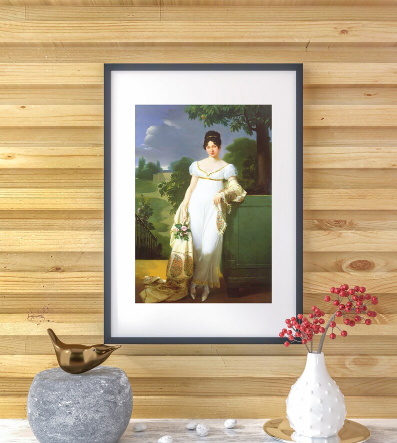 May include: A framed portrait of a woman in a white dress standing in a garden setting. She is holding a bouquet of flowers and is leaning against a green pillar. The painting is set against a wood-paneled wall.