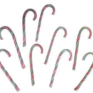 May include: A group of eight candy canes with red, white, and green stripes. The candy canes are arranged in a fan shape.