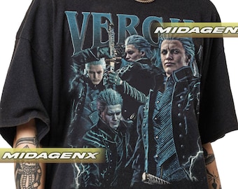 May include: Black t-shirt with a graphic print of four characters from the video game Devil May Cry. The characters are standing in front of a lightning bolt. The text "VERGIL" is printed in large letters at the top of the graphic. The text "MIDAGEN" is printed in smaller letters at the top right of the graphic. The text "MIDAGENX" is printed in large letters at the bottom left of the graphic.