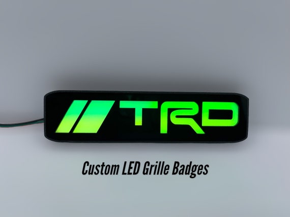 アクセサリー TRD GRILLE BADGE Amazon.com: TRD Grille Decor Badge, 3-Color Upgrade Emblem