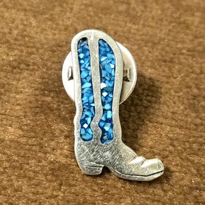 May include: A rustic wooden sign with the text "Welcome to our home" in white lettering. The sign features a distressed finish and a simple, inviting design, perfect for front door decor.