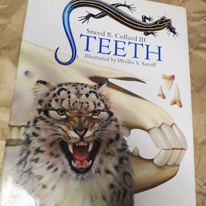 May include: A book cover with a white background and a blue and black lizard with the title "Teeth" by Sneed B. Collard III. The cover also features a close-up of a snow leopard with its mouth open, showing its teeth.