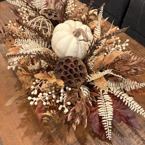 Fall pumpkin centerpiece in wooden planter