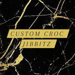 Black crocs customised with silver jibbitz💿