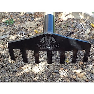 May include: Black metal garden rake with a wooden handle. The rake has seven tines and features a black and white logo with the word "ROGUE" and an elephant design.