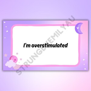 May include: A rectangular sign with a white interior and a pink and purple border. The text "I'm overstimulated" is centered in black. The corners feature illustrations of a moon, stars, and clouds.