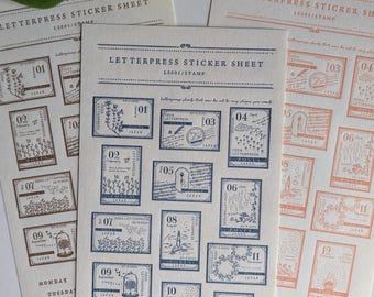 May include: Three sheets of letterpress stickers with a variety of designs. The stickers are in the shape of postage stamps and feature illustrations of flowers, trees, and other nature-inspired motifs. The text on the stickers includes the words "Japan", "Oeda Letterpress", and "Monday" through "Sunday".