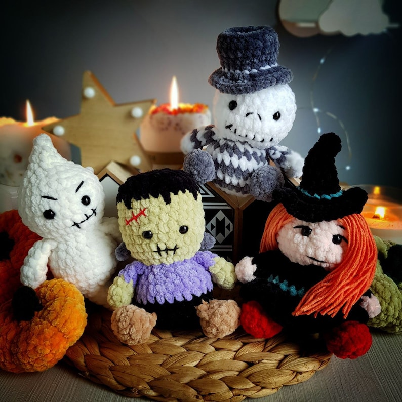 May include: Five crocheted Halloween characters: a ghost, a zombie, a witch, a skeleton, and a pumpkin. The characters are all handmade and have unique details.