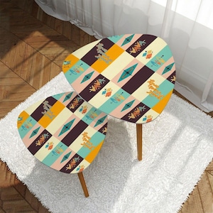 May include: Two retro-style side tables with a colorful geometric pattern. The tables have a mid-century modern design with wooden legs and a patterned top featuring diamonds, lines, and the text "Love the Vibes Only".
