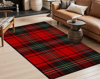 May include: A rectangular red plaid rug with black, yellow, and teal accents. The rug is placed on a light wood floor in a living room setting. The plaid pattern is a classic design.