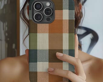 May include: A smartphone case featuring a woven-look plaid pattern in shades of burnt orange, sage green, dark charcoal, and cream. The case has a rectangular shape with rounded corners and a cutout for the rear camera lens array.