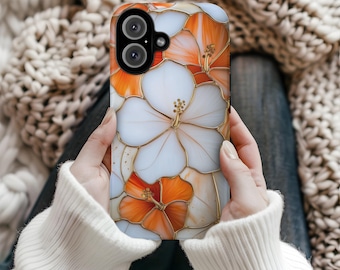 May include: A phone case featuring a floral design with white and orange hibiscus flowers. The flowers are outlined in gold, creating a stained-glass effect. The case has a dual-lens camera cutout.