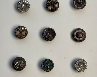 Card of 15 Austrian Tiny buttons.