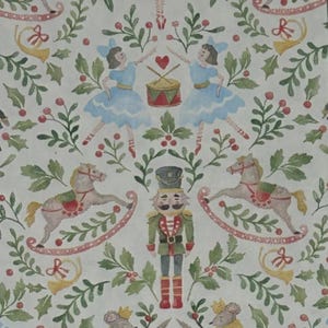 May include: Watercolor pattern featuring Christmas-themed illustrations. The design includes ballerinas in blue dresses, a nutcracker, rocking horses, drums, and festive greenery with red berries, all set against a white background.