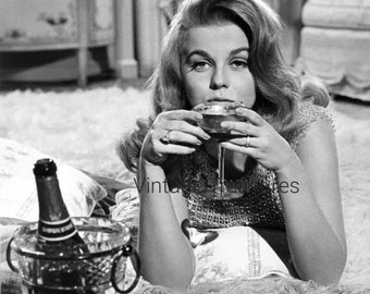 Ann Margaret Relaxes with a Glass of Champaign