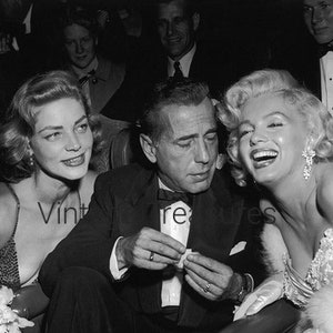 What Humphrey was Thinking? Marilyn Monroe, Lauren Bacall, Humphrey  Bogart at the Premiere of How to Marry a Millionaire.