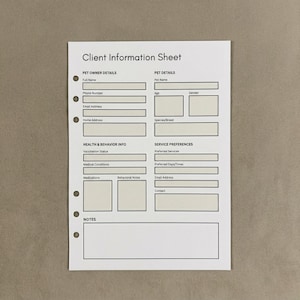May include: A white Client Information Sheet with black text, designed for pet owners. The sheet includes sections for pet owner details, pet details, health and behaviour information, and service preferences. It has pre-printed fields for easy completion and is hole-punched for a binder.