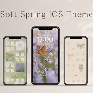 May include: Three iPhone mockups displaying a soft spring iOS theme with a light beige background. The center phone shows a lavender field with a butterfly and the text "BEAUTIFUL dreamer". The left and right phones show a grid of app icons with a light green and beige color scheme.