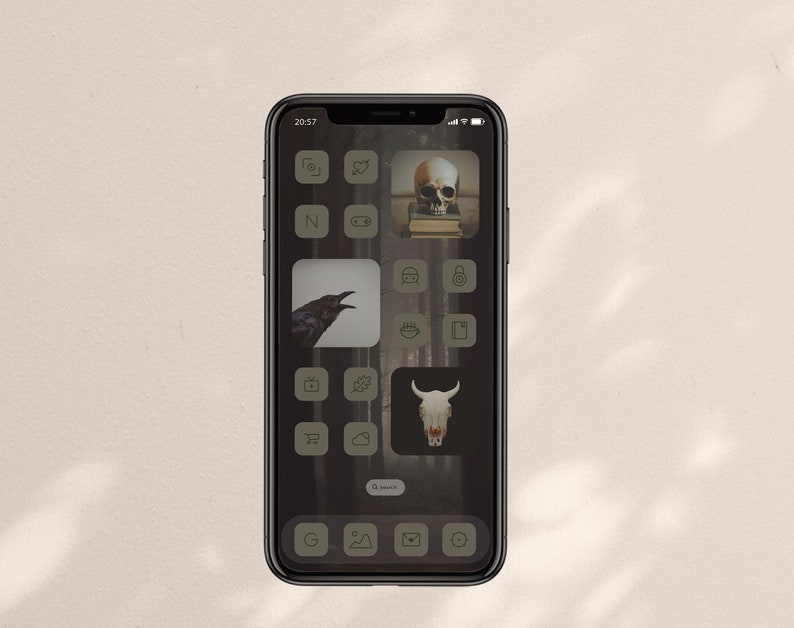 spooky woods wallpaper with grey-green icons and widgets with pictures of skulls, books and a raven