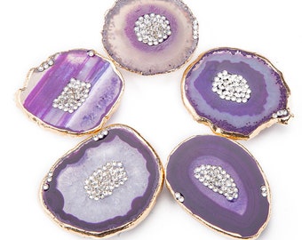 May include: Five purple agate coasters with gold trim and clear rhinestone accents.