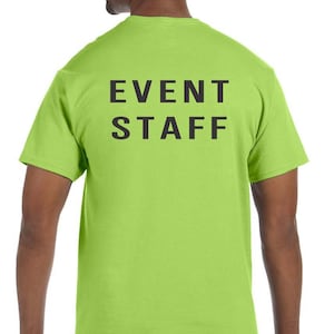 May include: A lime green t-shirt with the text "EVENT STAFF" printed in black on the back.