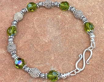 olive green crystal & Bali silver bracelet, 7 1/2 inches