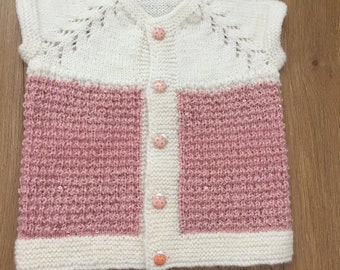 hand knitted baby vests