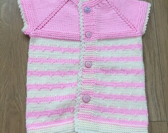 hand knitted baby vests