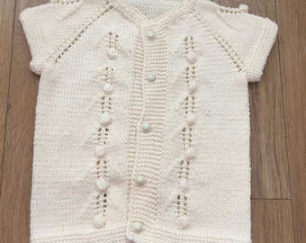 hand knitted baby vests