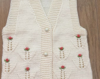 hand knitted baby vests