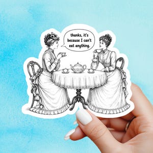 May include: A die-cut sticker featuring a black and white vintage-style illustration of two people in Victorian-era clothing sitting at a round table with a teapot and cups. A speech bubble contains the text, thanks, it's because I can't eat anything.