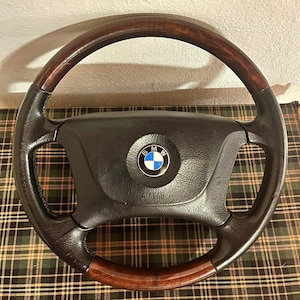 Vintage original steering wheel for BMW. Used condition.  BMW e39 wooden steering wheel with leather insert, beautiful, vintage condition,