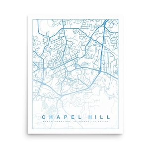 May include: A blue and white map of Chapel Hill, North Carolina. The map shows the streets and roads of the city. The text "Chapel Hill" and "North Carolina, 35.9053, -79.047753" is at the bottom of the map.