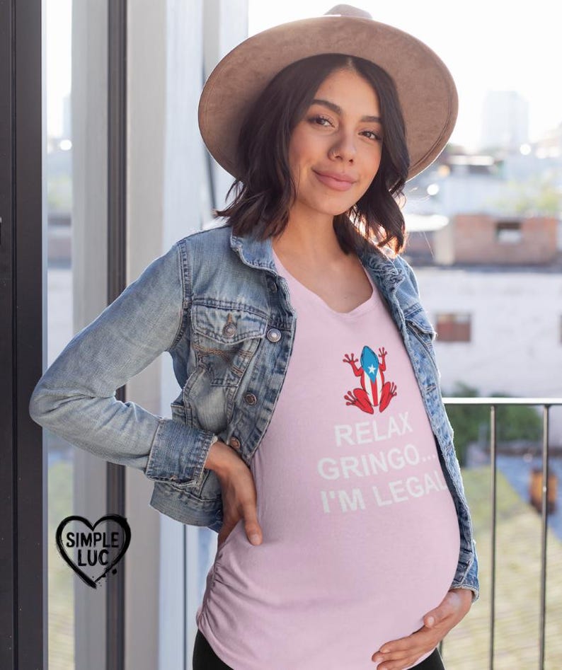 May include: A pink maternity t-shirt with a white Puerto Rican flag frog graphic and the text "Relax Gringo... I'm Legal".