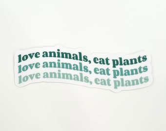 May include: A sticker with the text "love animals, eat plants" repeated three times in a gradient of green colours.