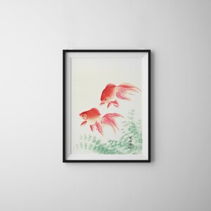 May include: A framed watercolor painting of two red goldfish swimming in a green pond. The painting is signed in Japanese characters.