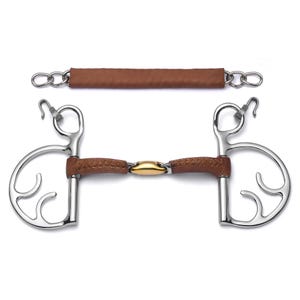 May include: A stainless steel horse bit with a brown leather-wrapped mouthpiece and a gold-colored center link. The bit includes a separate brown leather strap with chain links. The design is for equestrian use.