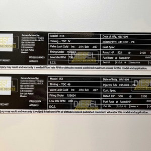 May include: Black and yellow engine decal with the text "Diesel Engine Decals" and information about a remanufactured N14 engine. The decal includes the engine model, date of manufacture, injector part number, rated horsepower, fuel rate, and other specifications.