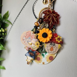 Sleutelhanger met zonnebloemmotief | Herfstbladeren en vogelverschrikkers | Herfsttasversiering | Handtasaccessoire