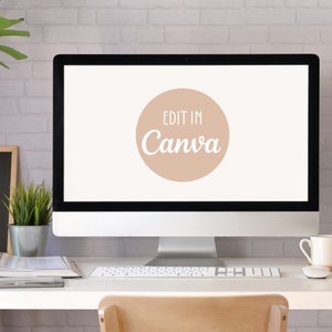 May include: A white desktop computer with a light brown circle on the screen that says "Edit in Canva" in white text. The computer is on a white desk with a white keyboard and a white mug.
